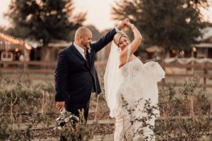 Couple posing for wedding photo shoot at Wishing Well Barn Banner