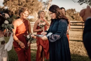 People standing at outside wedding venue Banner